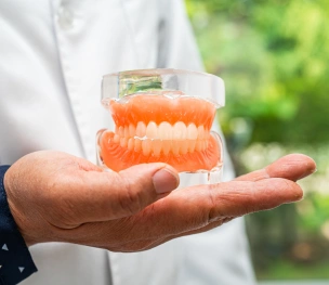 Full dentures replacing an entire arch of missing teeth.