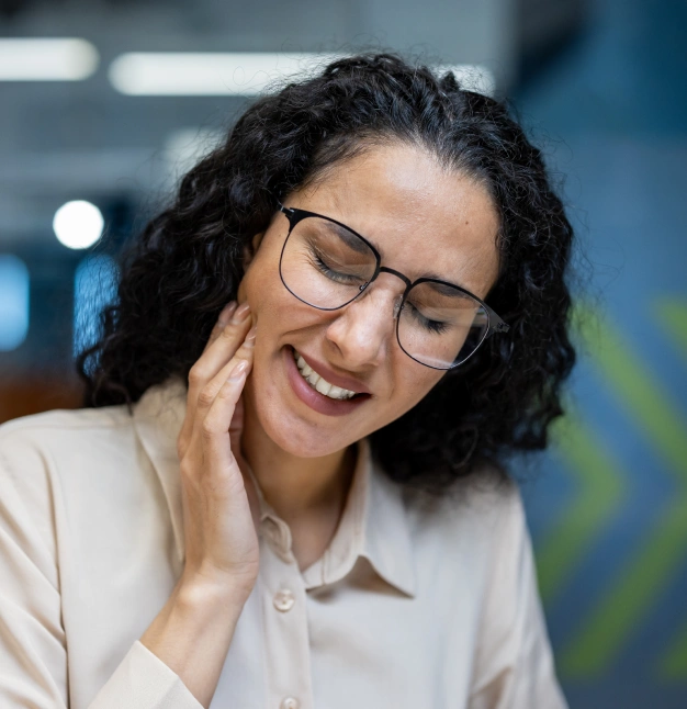 Dentist providing TMJ/TMD therapy to relieve jaw pain and discomfort.